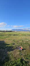 View of yard with a view of countryside and a mountain view