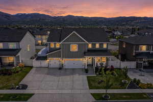 View of front of home featuring a gate, board and batten siding, a porch, and a residential view