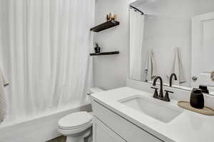 Bathroom with vanity and shower / bath combo
