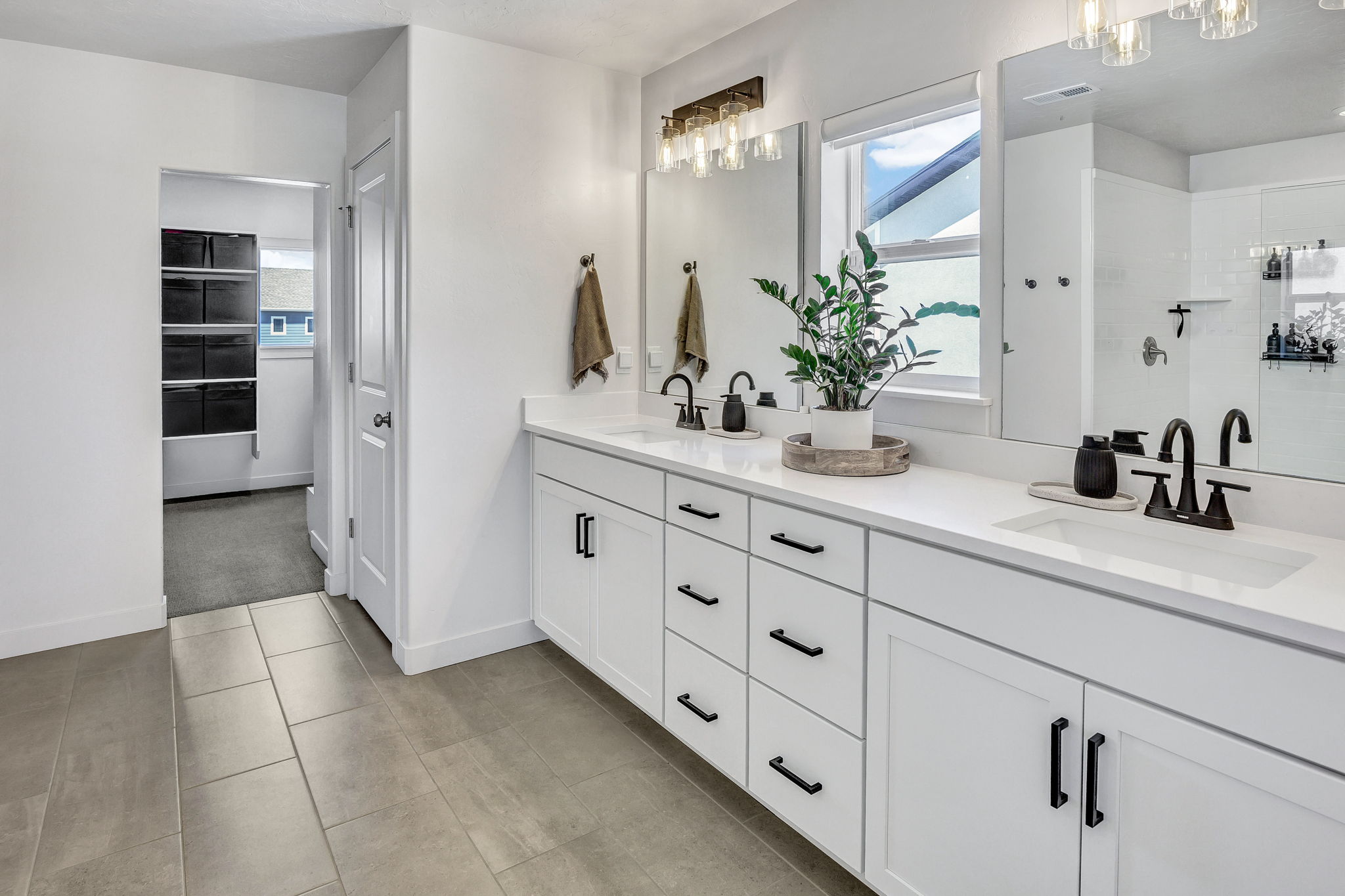 Bathroom with double vanity and walk in shower