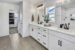 Bathroom with double vanity and walk in shower