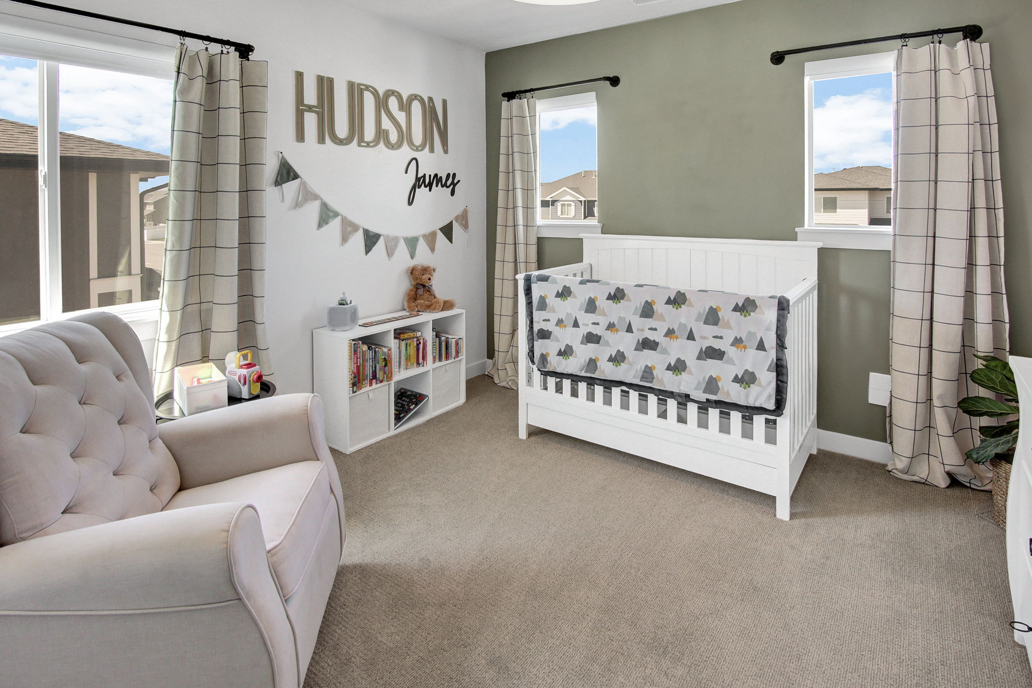 Carpeted bedroom featuring multiple windows
