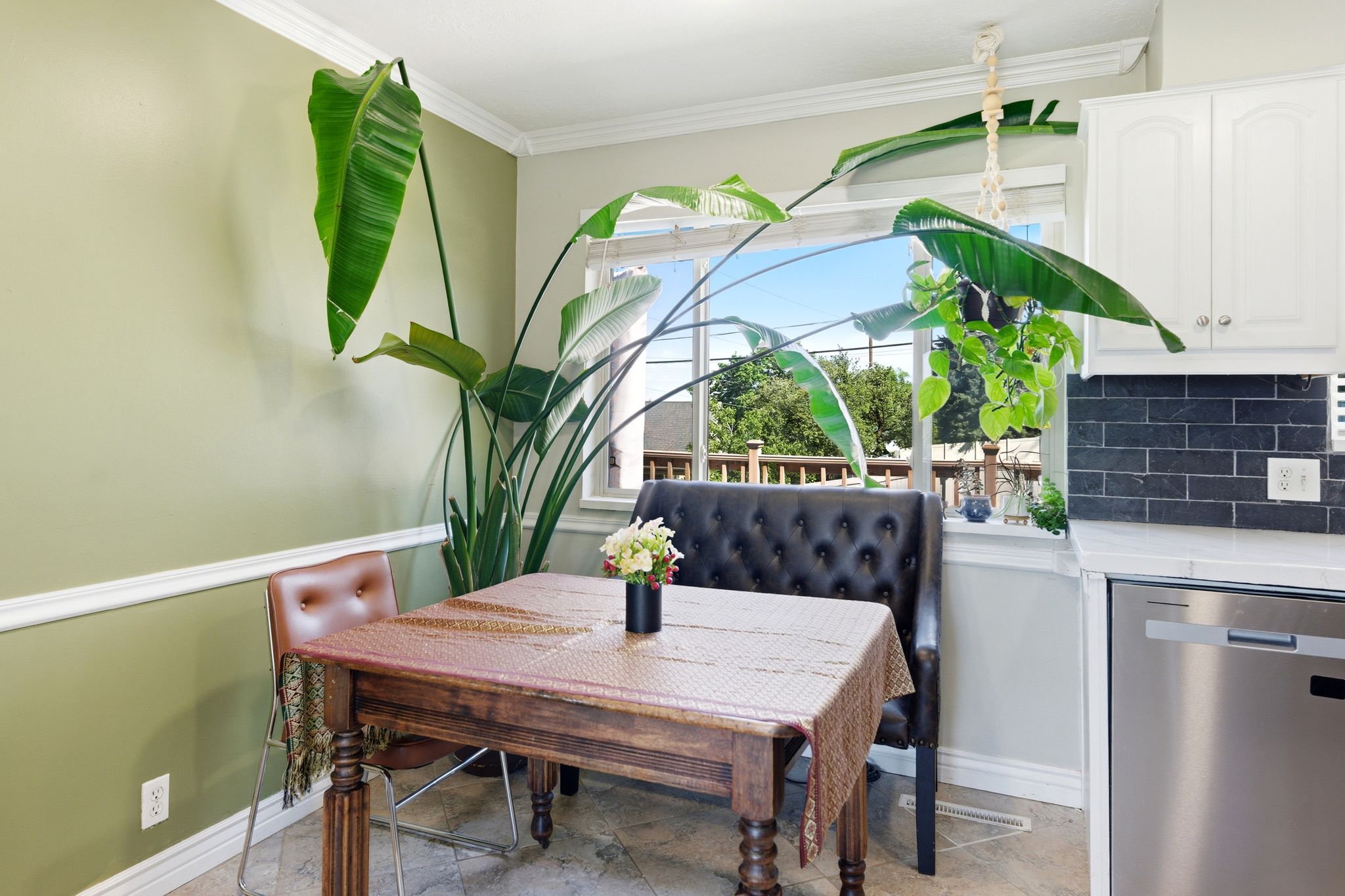 Dining area featuring ornamental molding and baseboards
