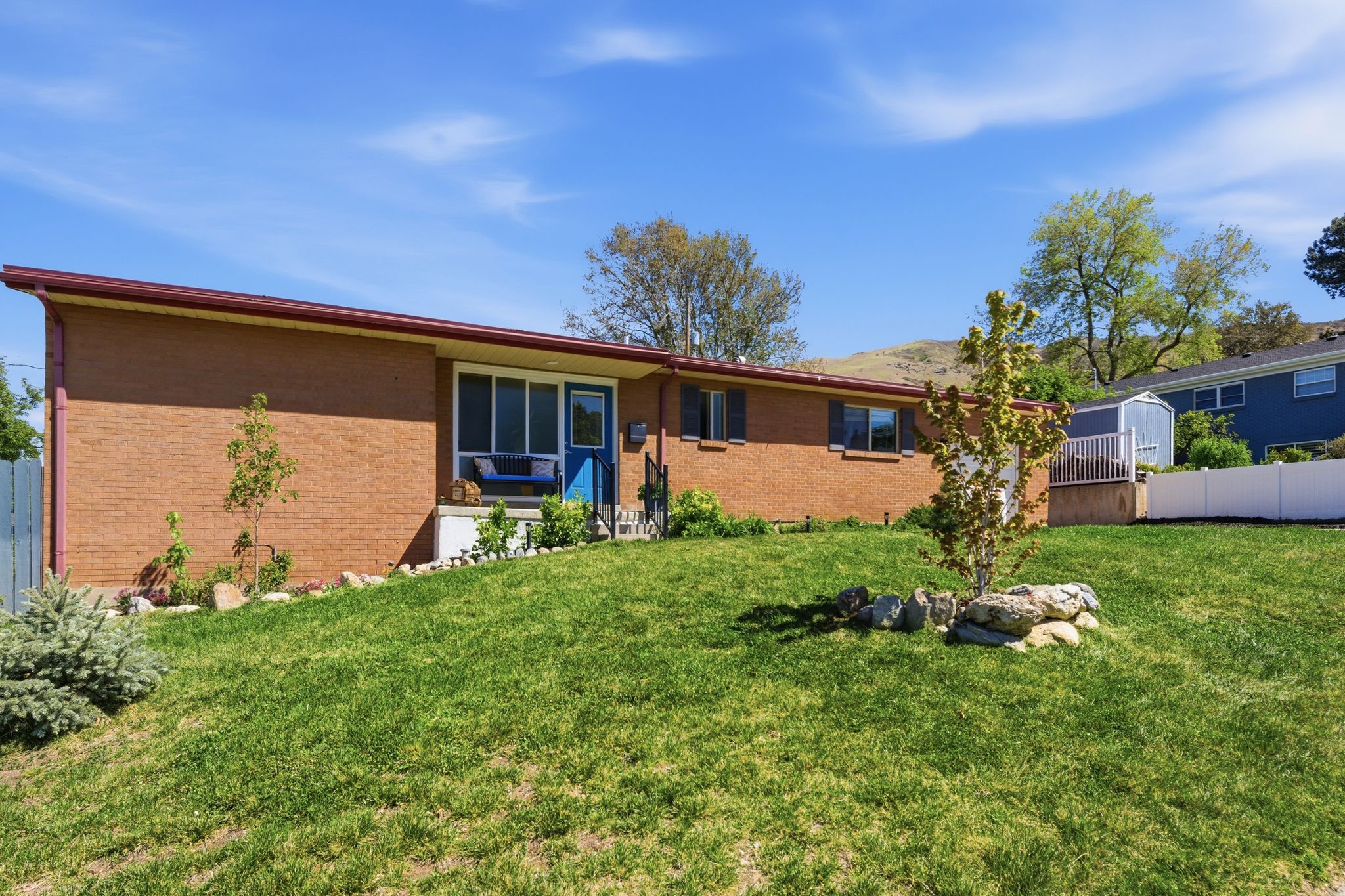 Back of house featuring brick siding