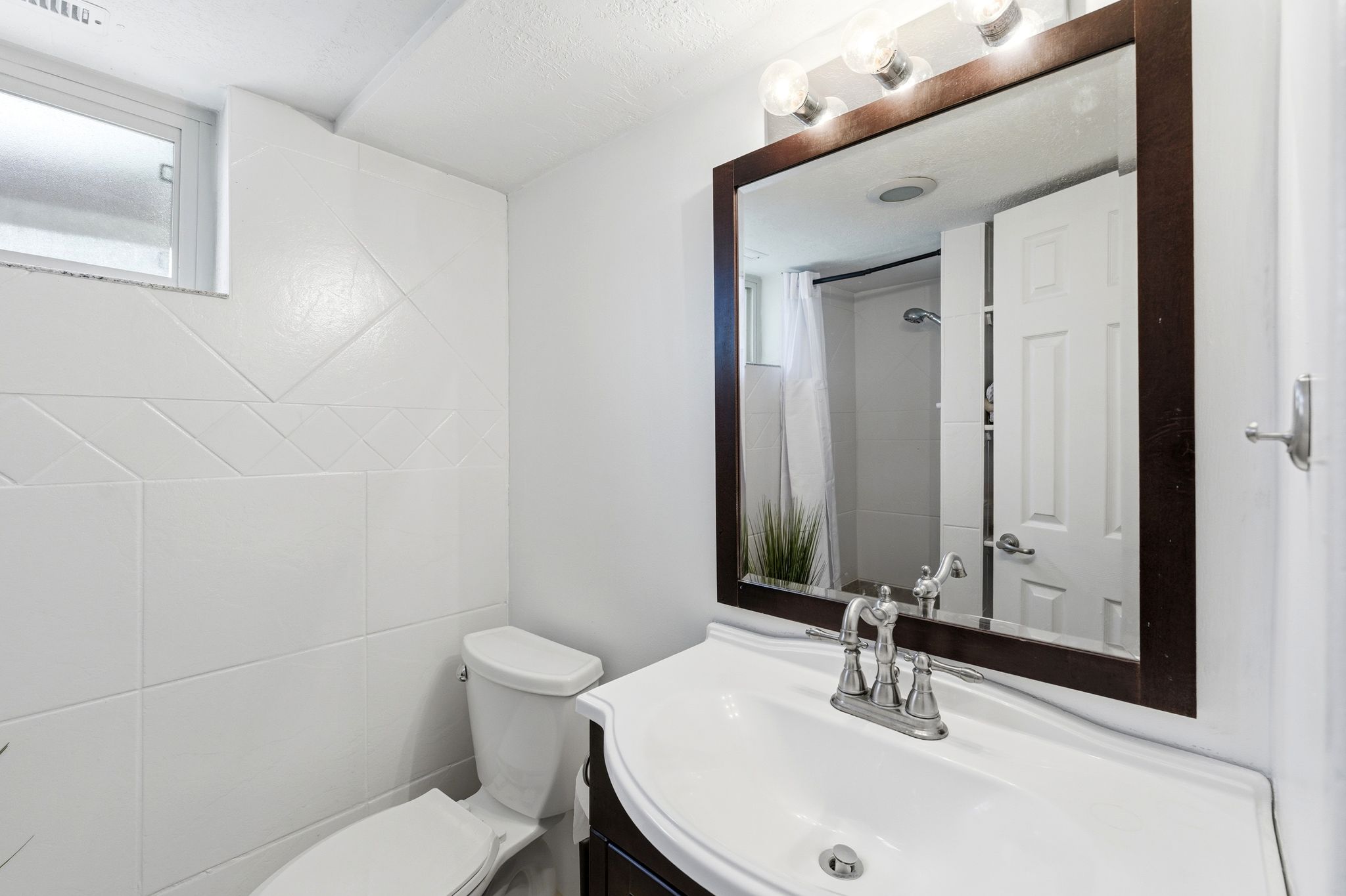 Full bath with vanity and curtained shower