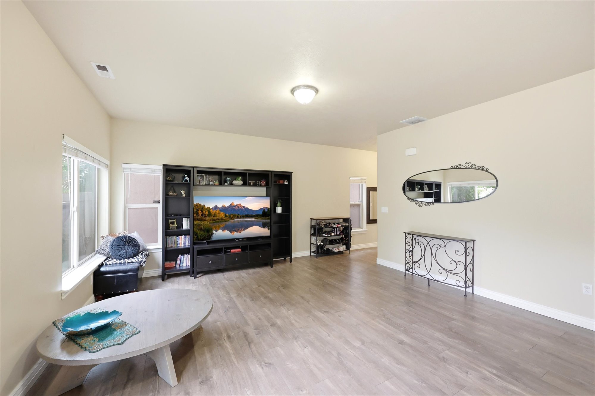 Living area featuring light wood-style flooring and baseboards