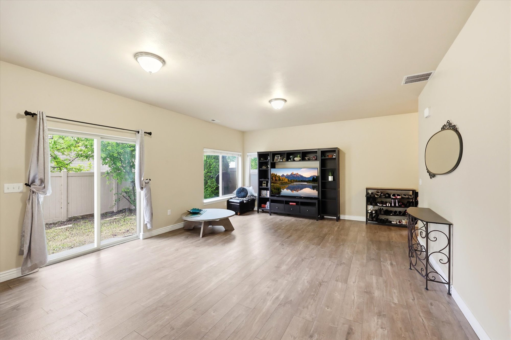 Sitting room featuring light wood-style floors and baseboards