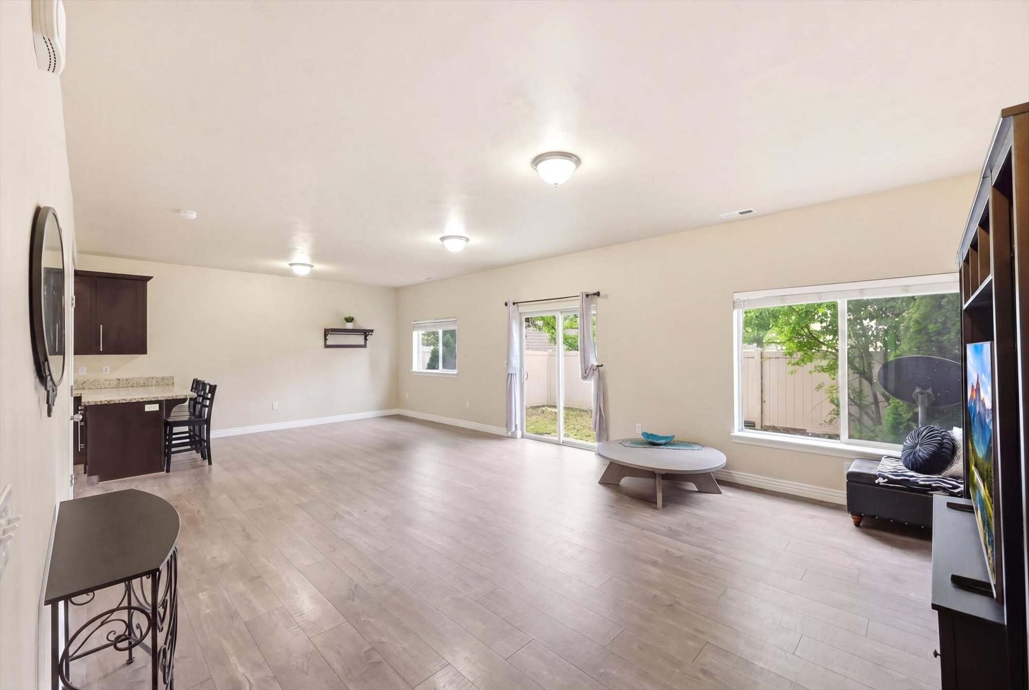 Living area featuring baseboards and light wood-style flooring
