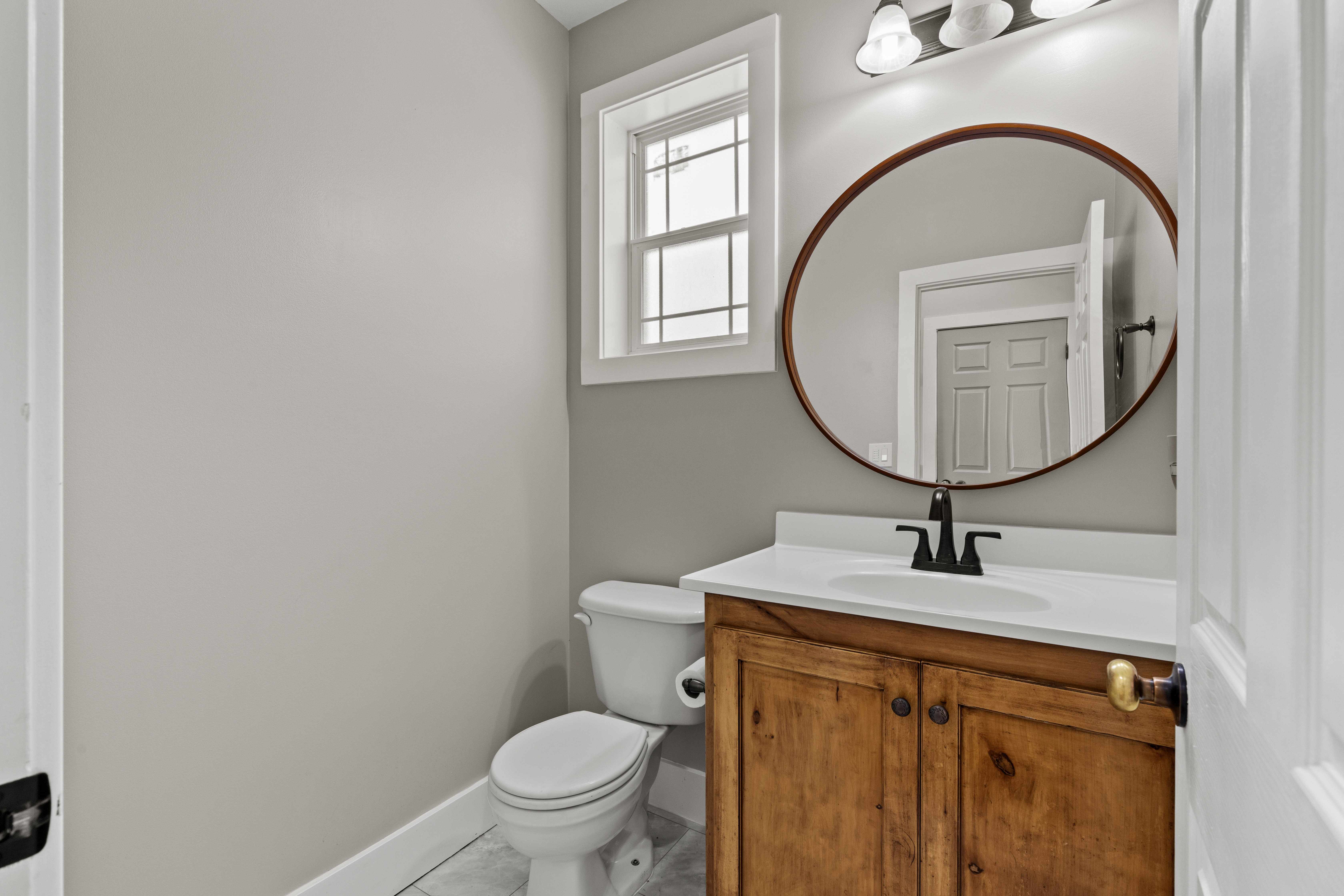 Bathroom with vanity and light tile patterned floors
