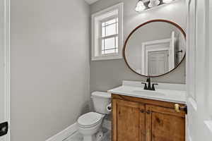 Bathroom with vanity and light tile patterned floors