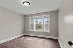 Empty room with light wood-style floors