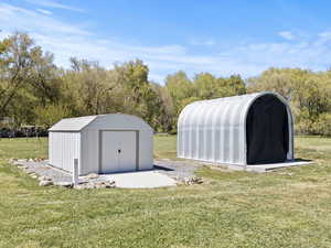 View of shed featuring view of scattered trees