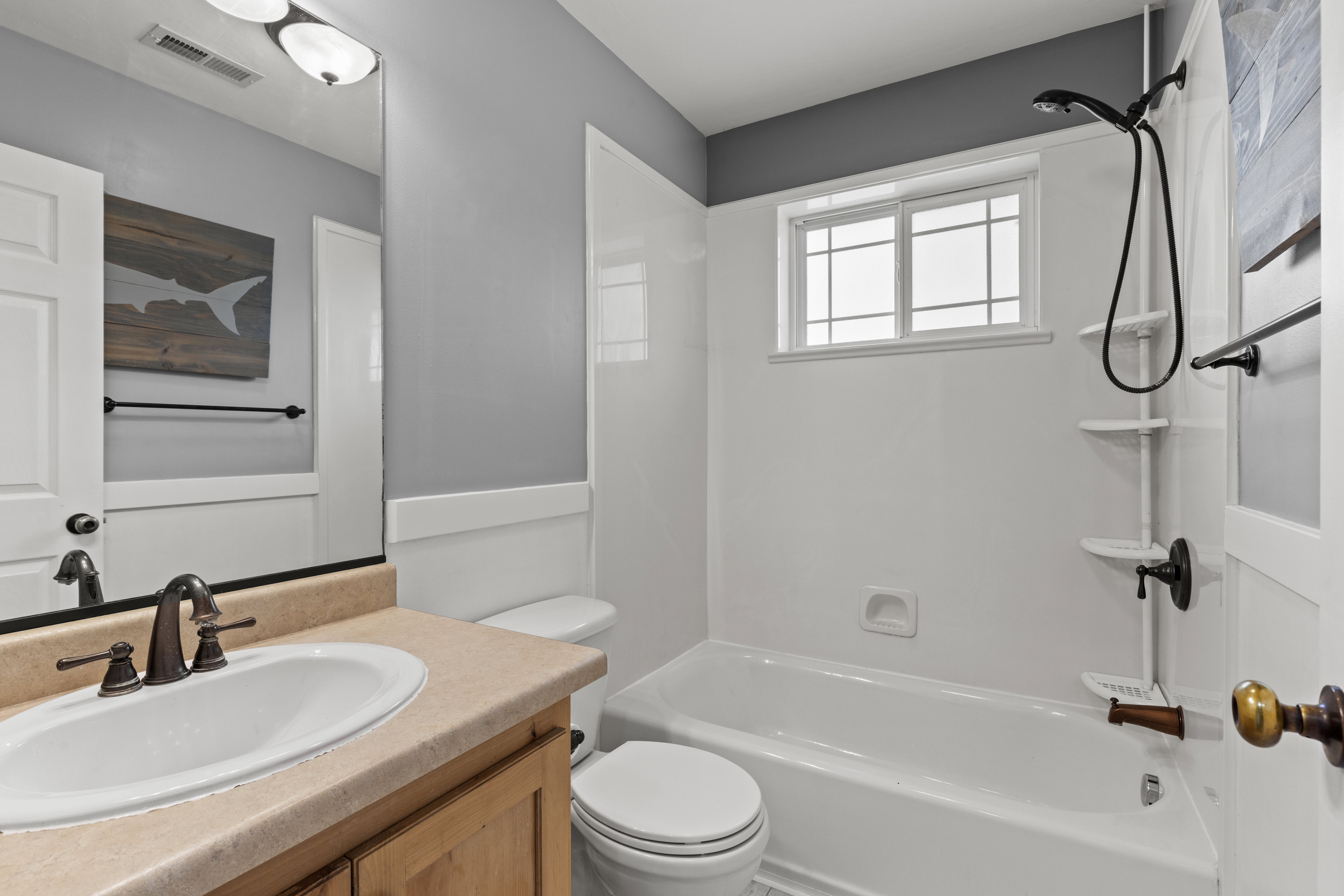 Full bathroom with vanity and bathing tub / shower combination