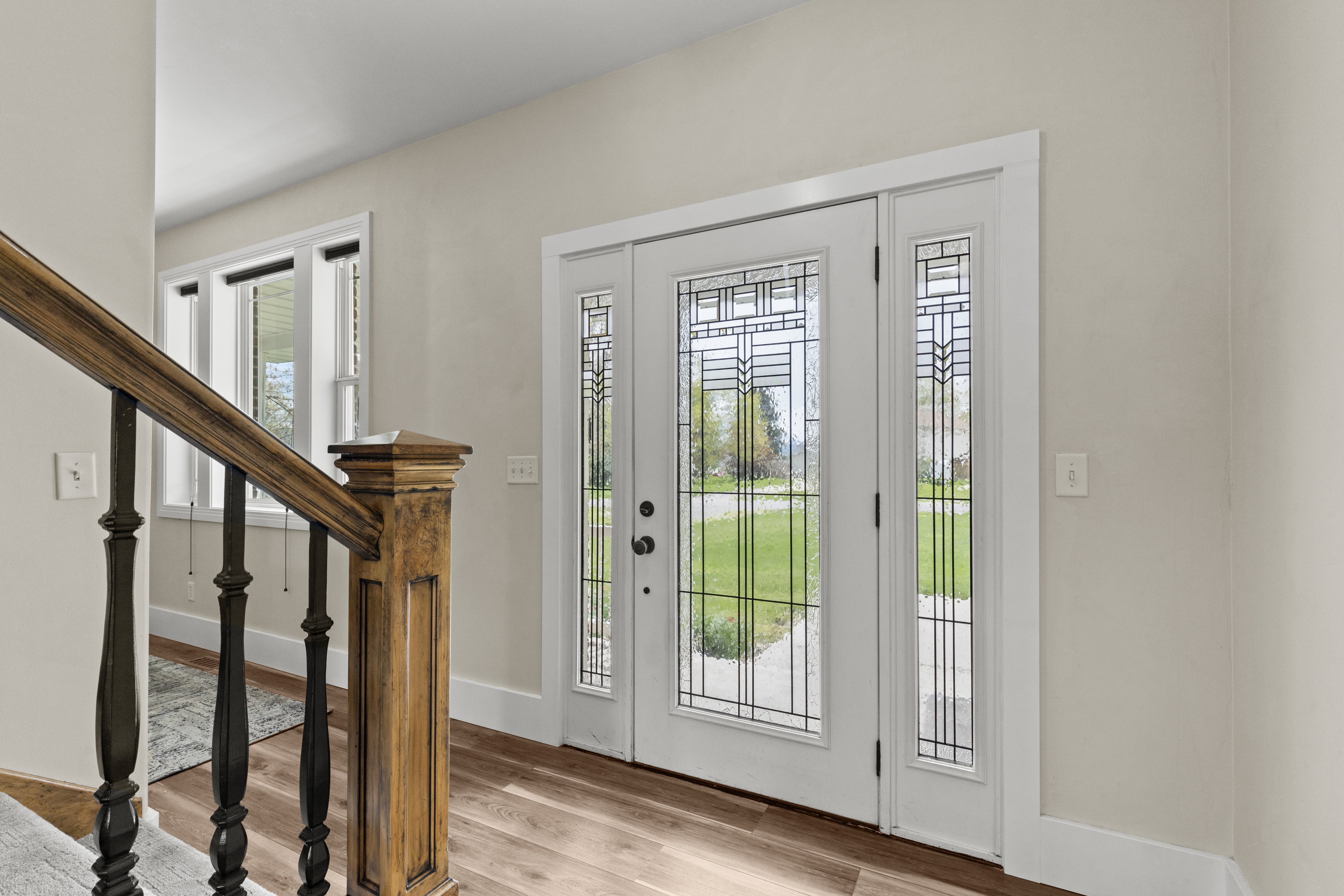 Entrance foyer with stairs and light wood-type flooring