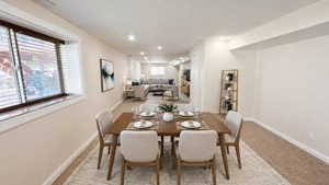 AI Generated Staging -Dining space featuring light carpet and recessed lighting