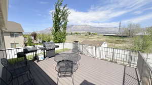 Deck with grilling area and a mountain view