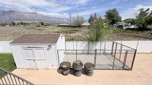 Shed for storage a dog run, a patio, and a mountain view