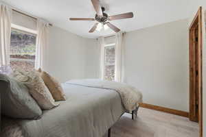 Bedroom featuring light wood-style flooring and ceiling fan