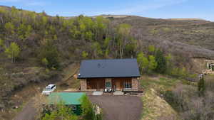View from above of property with a mountain backdrop