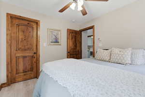 Bedroom featuring ceiling fan and light wood-type flooring