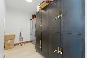 Interior space with high end refrigerator and wood finished floors