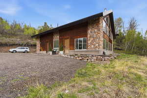View of side of property with stone siding