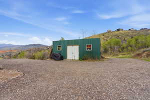 View of outbuilding featuring a mountain view