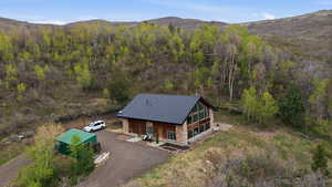 View from above of property featuring a mountainous background