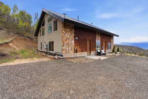 Rear view of house featuring a mountain view