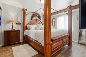 Bedroom featuring wood finished floors