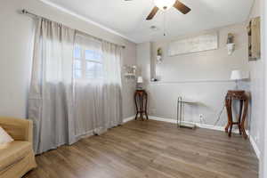 Unfurnished room with ceiling fan and wood finished floors