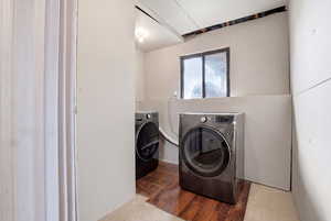 Laundry room featuring washing machine and clothes dryer