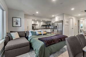 Living room/kitchen area with sofa sleeper extended