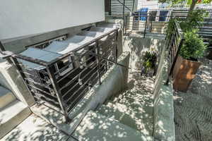 Outside entrance to basement ADU with privacy awning