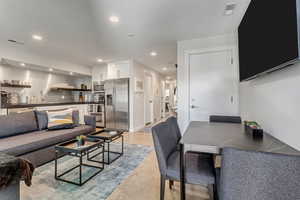 ADU living room.  The door pictured on the right side of the photo leads to the upstairs.  The deadbolt is controlled by the upstairs unit.