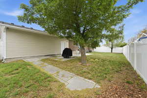 Fenced backyard featuring a patio area