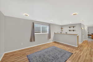 Living area featuring light wood-style flooring