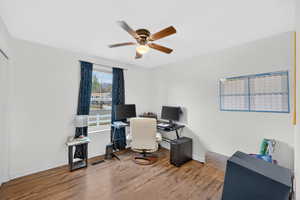 Office featuring hardwood / wood-style flooring and a ceiling fan