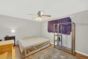 Bedroom featuring light wood-style floors and a ceiling fan