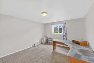 Office area with carpet flooring and baseboards