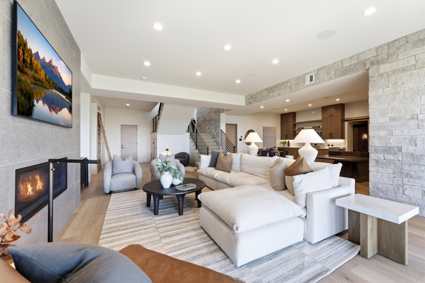 Living area featuring a fireplace, light wood-style floors, and recessed lighting