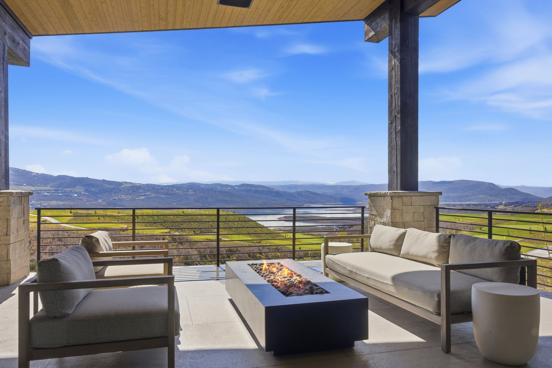 View of patio / terrace with an outdoor living space with a fire pit and a water and mountain view