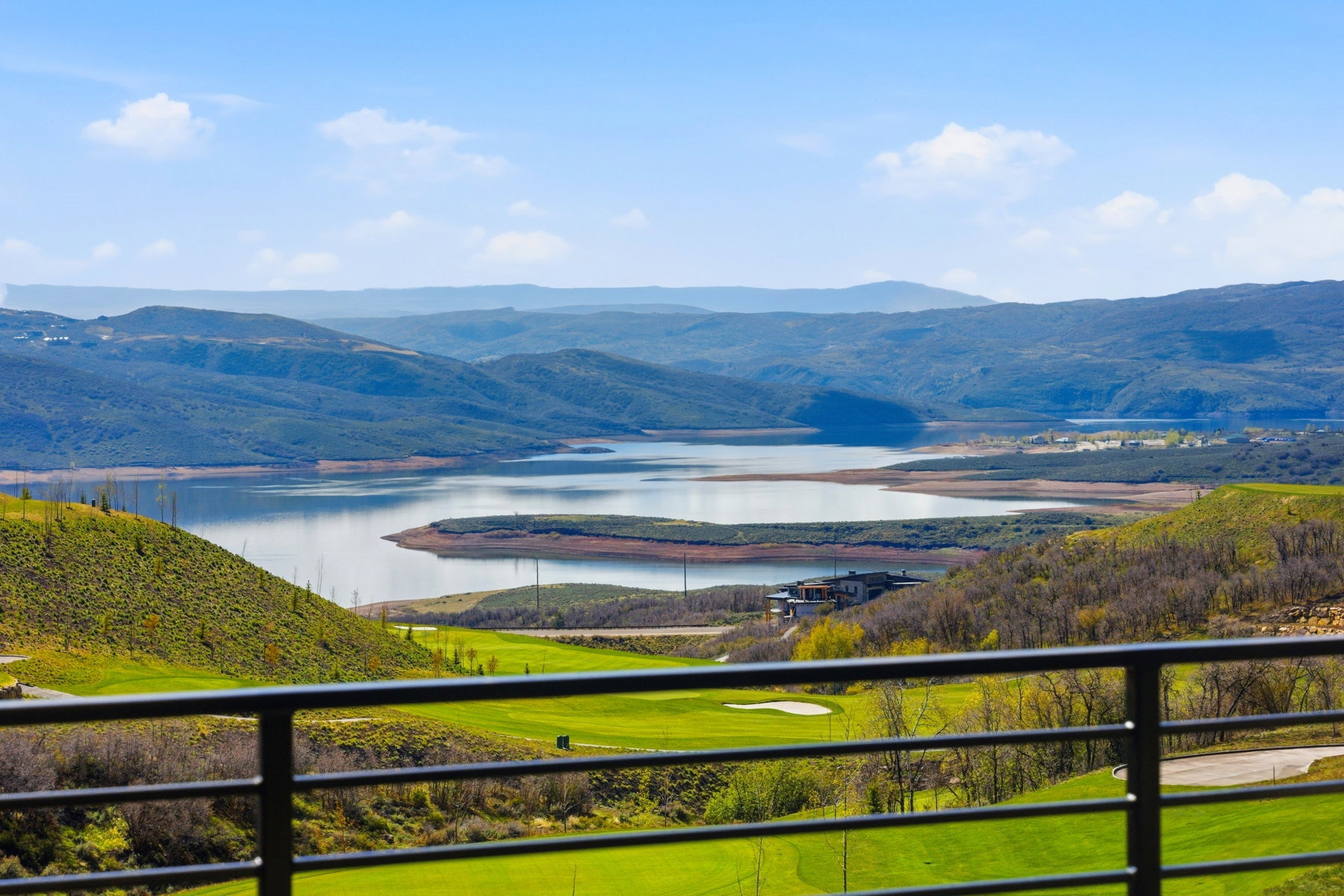 View of mountain backdrop featuring a nearby body of water