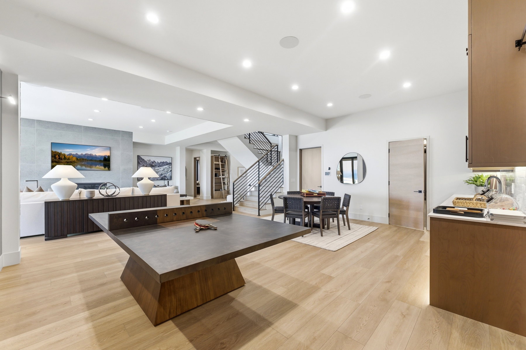 Kitchen with light wood-style flooring, recessed lighting, a kitchen island, and open floor plan
