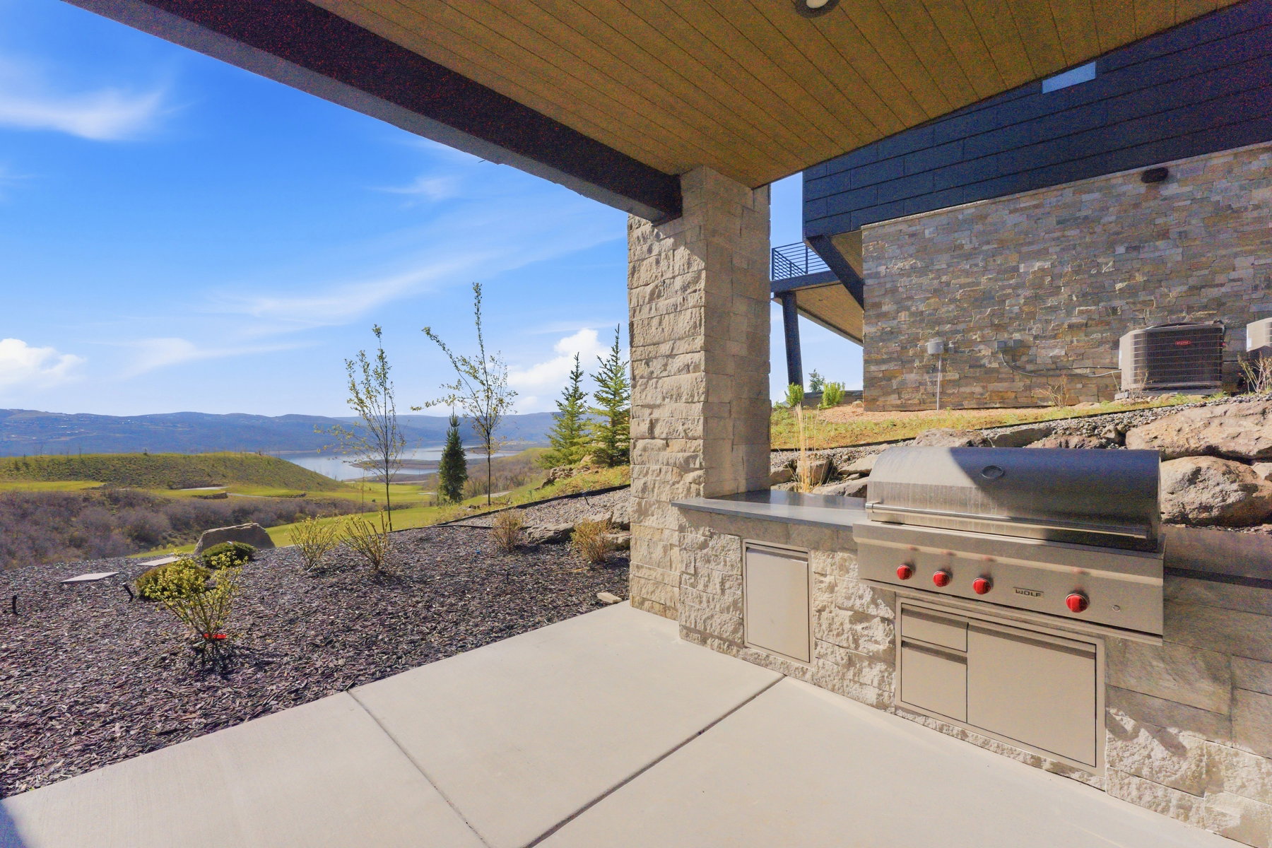 View of patio with a mountain view and exterior kitchen