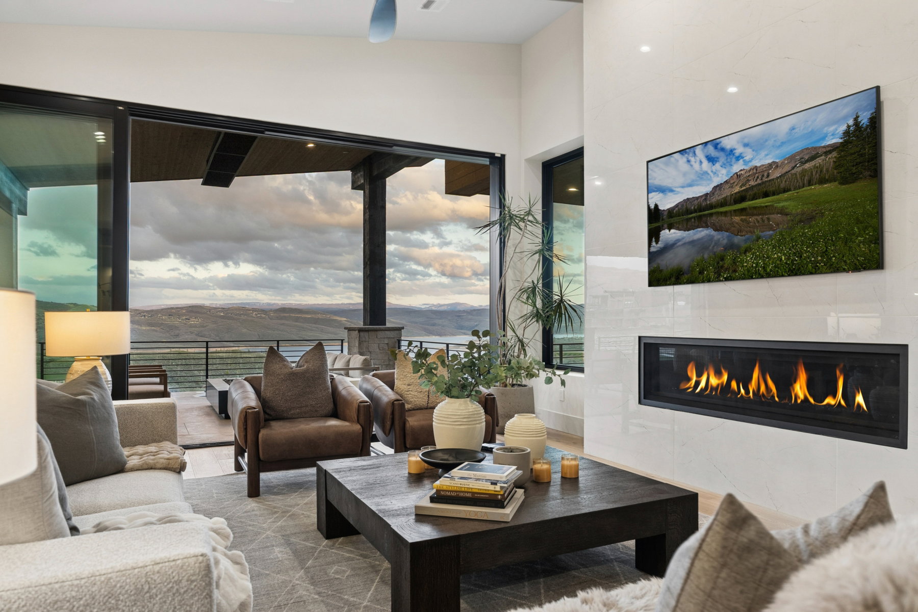 Living area featuring a tiled fireplace and wood finished floors