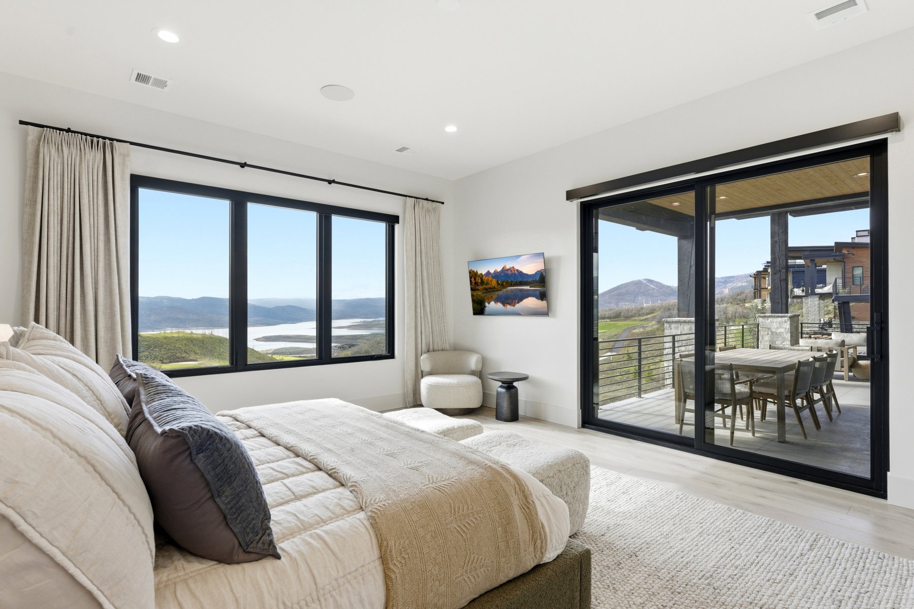 Bedroom featuring light wood-style floors, access to exterior, and recessed lighting