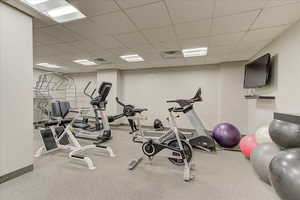 Gym featuring a paneled ceiling