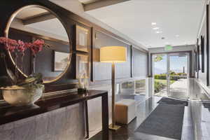 Bathroom with recessed lighting, vanity, and tile walls