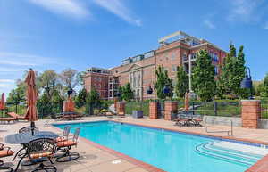 Community pool featuring a patio area